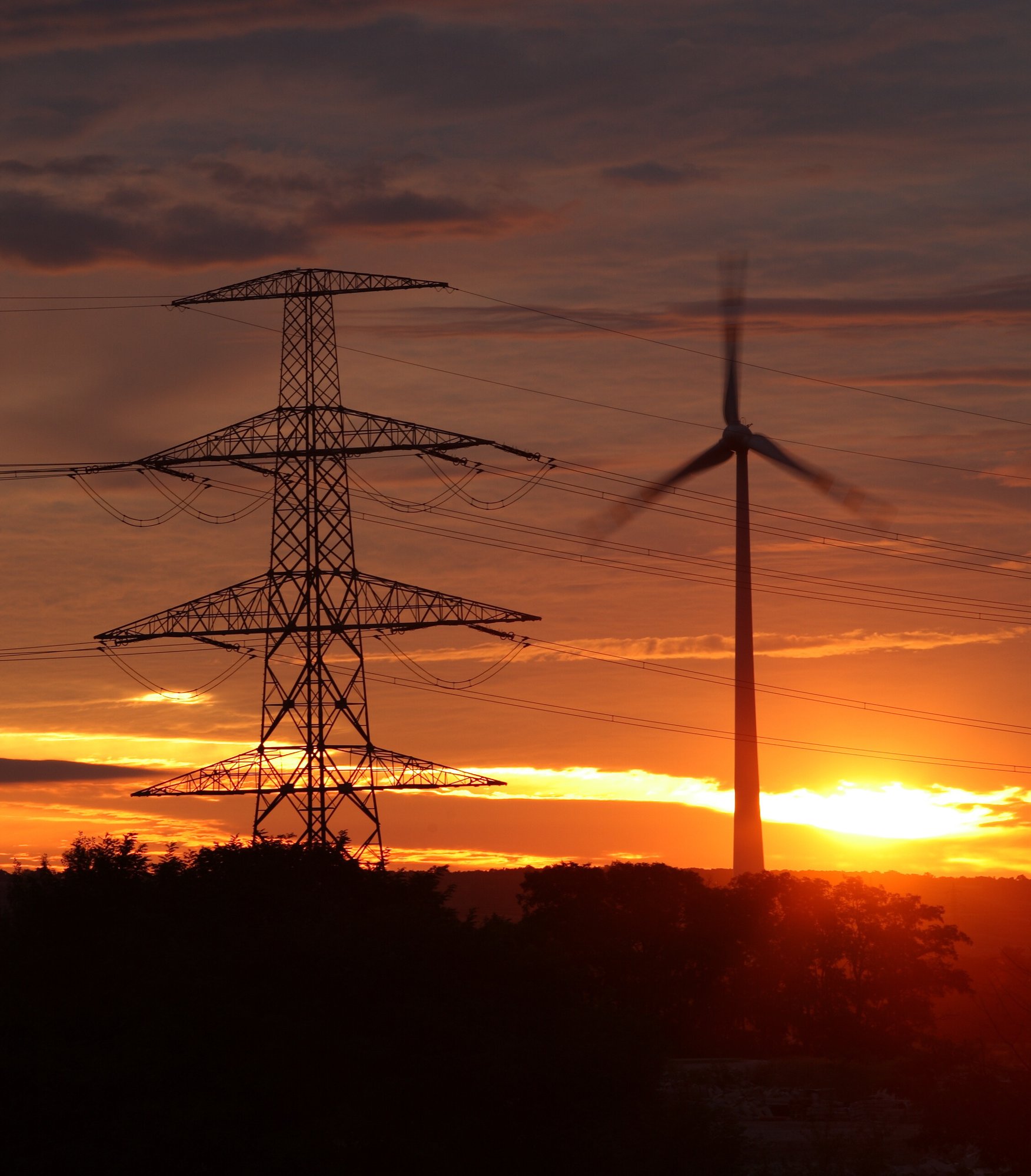 wind-energy-harvesting-wind-mills-at-sunrise-2021-09-01-00-23-28-utc